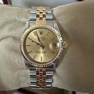 Women’s Rolex Datejust 31
mm 18k Two Tone Yellow Gold Champagne Dial Jubilee